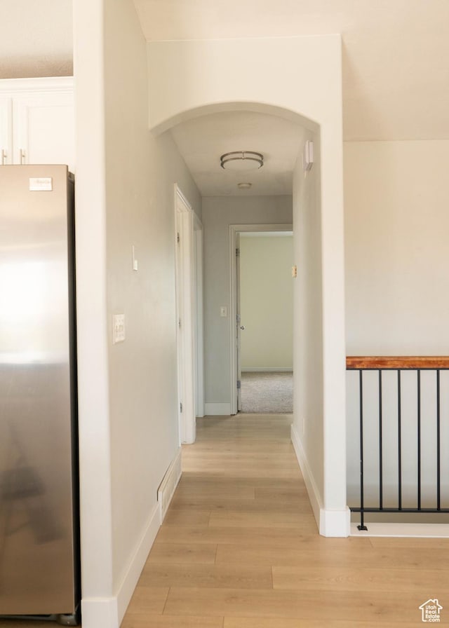 4636 E Ponderosa Way, Eagle Mountain, UT 84005 - hallway with arched walkways and light wood finished floors