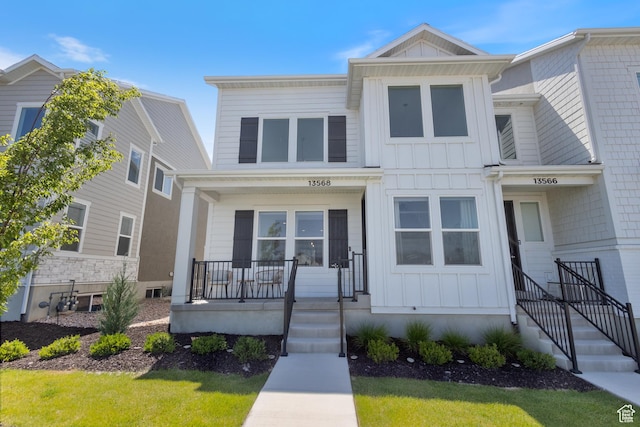 13568 S Vernet Dr W Unit 1824, Riverton, UT 84096 - view of front of house with board and batten siding and a porch