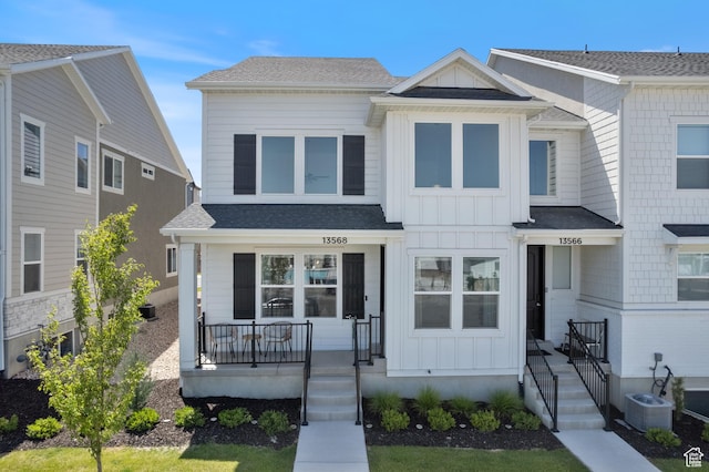 13568 S Vernet Dr W Unit 1824, Riverton, UT 84096 - townhome / multi-family property featuring board and batten siding, covered porch, and roof with shingles