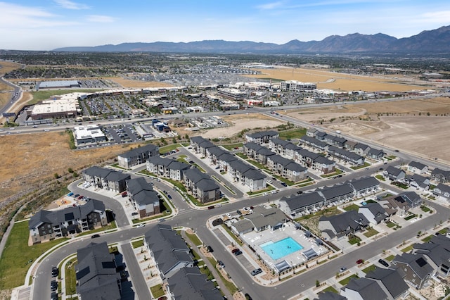 13568 S Vernet Dr W Unit 1824, Riverton, UT 84096 - aerial view of property and surrounding area featuring a mountainous background and a pool area