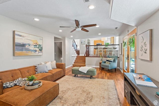 8378 S Sycamore Tree Cv E, Sandy, UT 84094 - living room featuring wood finished floors, stairway, recessed lighting, and ceiling fan
