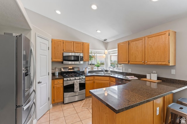 8378 S Sycamore Tree Cv E, Sandy, UT 84094 - kitchen with stainless steel appliances, a peninsula, vaulted ceiling, light tile patterned flooring, and recessed lighting