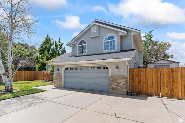 8378 S Sycamore Tree Cv E, Sandy, UT 84094 - traditional-style home with concrete driveway, stucco siding, an attached garage, and brick siding