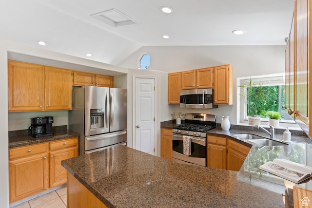 8378 S Sycamore Tree Cv E, Sandy, UT 84094 - kitchen with stainless steel appliances, lofted ceiling, a peninsula, dark stone countertops, and recessed lighting