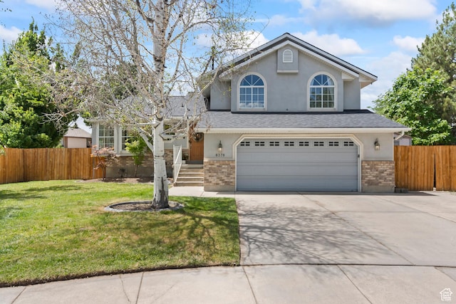 8378 S Sycamore Tree Cv E, Sandy, UT 84094 - traditional-style home featuring concrete driveway, an attached garage, stucco siding, brick siding, and roof with shingles