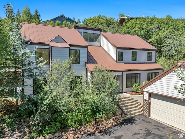3697 Wagon Wheel Way, Park City, UT 84098 - view of front of home featuring a garage, driveway, and a metal roof