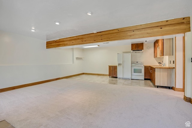 3697 Wagon Wheel Way, Park City, UT 84098 - basement with white fridge with ice dispenser, light colored carpet, and recessed lighting