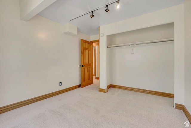 3697 Wagon Wheel Way, Park City, UT 84098 - unfurnished bedroom featuring carpet, a closet, and rail lighting