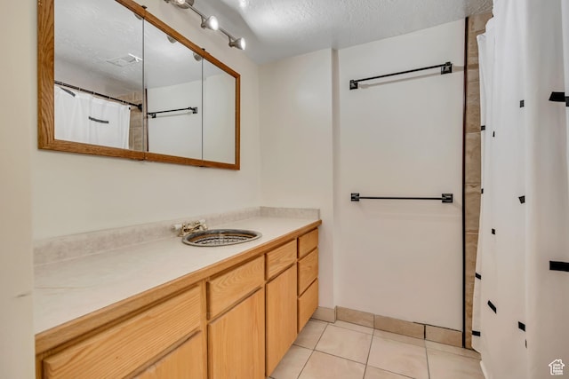 3697 Wagon Wheel Way, Park City, UT 84098 - bathroom with vanity, a textured ceiling, and tile patterned flooring