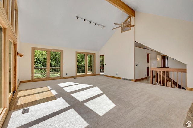 3697 Wagon Wheel Way, Park City, UT 84098 - unfurnished living room featuring track lighting, high vaulted ceiling, ceiling fan, and carpet