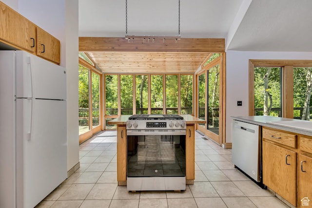 3697 Wagon Wheel Way, Park City, UT 84098 - kitchen with appliances with stainless steel finishes, light countertops, light tile patterned floors, lofted ceiling, and track lighting