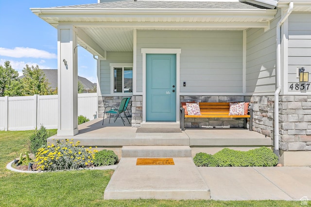 4857 N Goosefoot Dr, Eagle Mountain, UT 84005 - doorway to property with covered porch, stone siding, and a shingled roof