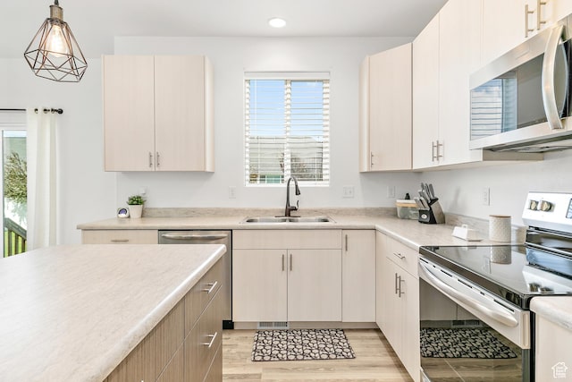 4857 N Goosefoot Dr, Eagle Mountain, UT 84005 - kitchen with appliances with stainless steel finishes, plenty of natural light, light countertops, and recessed lighting
