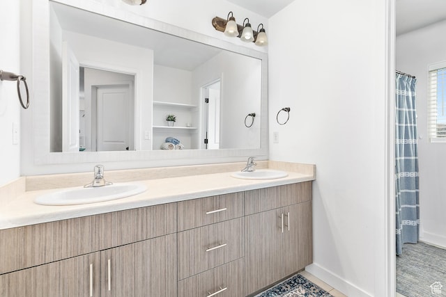 4857 N Goosefoot Dr, Eagle Mountain, UT 84005 - bathroom with double vanity and baseboards