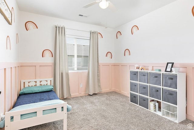 4857 N Goosefoot Dr, Eagle Mountain, UT 84005 - bedroom with carpet floors, a decorative wall, wainscoting, and ceiling fan