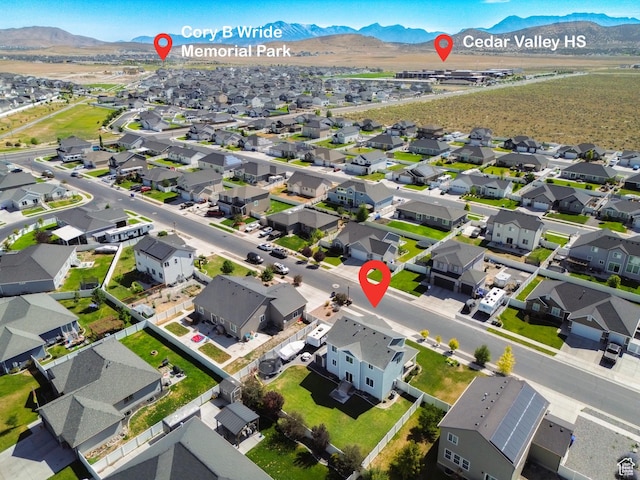 4857 N Goosefoot Dr, Eagle Mountain, UT 84005 - aerial overview of property's location with a mountain backdrop and nearby suburban area