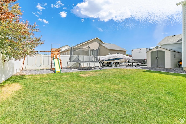4857 N Goosefoot Dr, Eagle Mountain, UT 84005 - fenced backyard featuring a trampoline, a storage shed, a playground, and a patio area