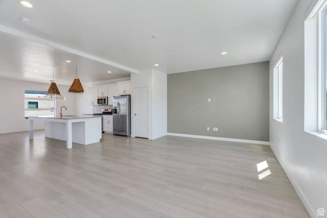 753 W Crystal Creek Rd, American Fork, UT 84003 - unfurnished living room featuring light wood-style flooring and recessed lighting