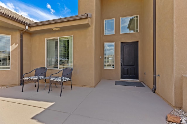 4323 W 2650th Cir S, Hurricane, UT 84737 - view of exterior entry featuring a patio and stucco siding