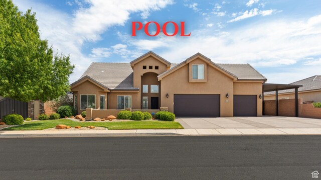 4323 W 2650th Cir S, Hurricane, UT 84737 - view of front of house featuring stucco siding, a garage, concrete driveway, and a tiled roof