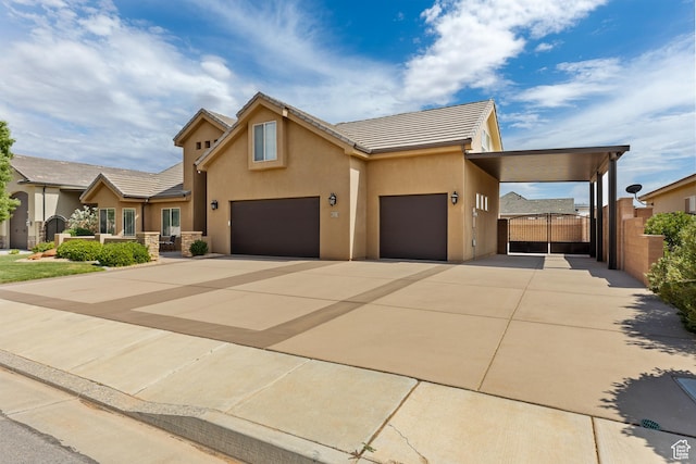 4323 W 2650th Cir S, Hurricane, UT 84737 - view of front of house featuring concrete driveway, stucco siding, an attached garage, and a tile roof