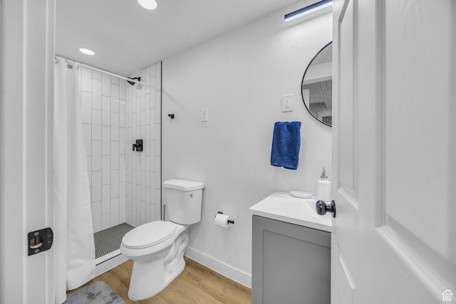 450 E 32 S, Ogden, UT 84401 - bathroom featuring vanity, wood finished floors, tiled shower, and recessed lighting