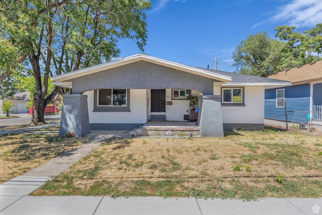 450 E 32 S, Ogden, UT 84401 - bungalow-style house featuring covered porch, brick siding, and a front lawn