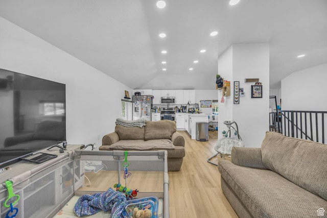 450 E 32 S, Ogden, UT 84401 - living area featuring light wood finished floors, vaulted ceiling, and recessed lighting