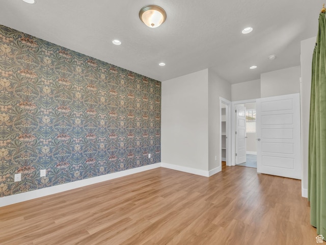 5103 W Black Twig Dr, South Jordan, UT 84009 - spare room featuring wood finished floors, recessed lighting, and wallpapered walls