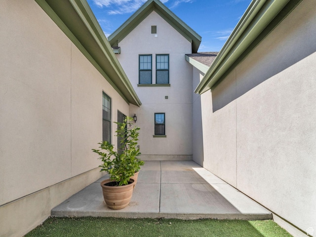 5103 W Black Twig Dr, South Jordan, UT 84009 - view of side of property featuring stucco siding and a patio area
