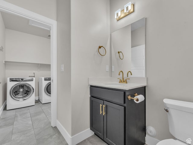 5103 W Black Twig Dr, South Jordan, UT 84009 - bathroom featuring vanity, washer and clothes dryer, and marble finish floors