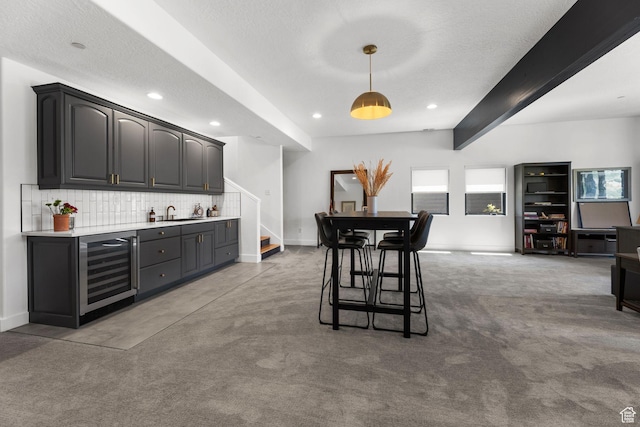 12403 Ross Creek Dr, Kamas, UT 84036 - carpeted dining room with beverage cooler, wet bar, stairway, recessed lighting, and beamed ceiling