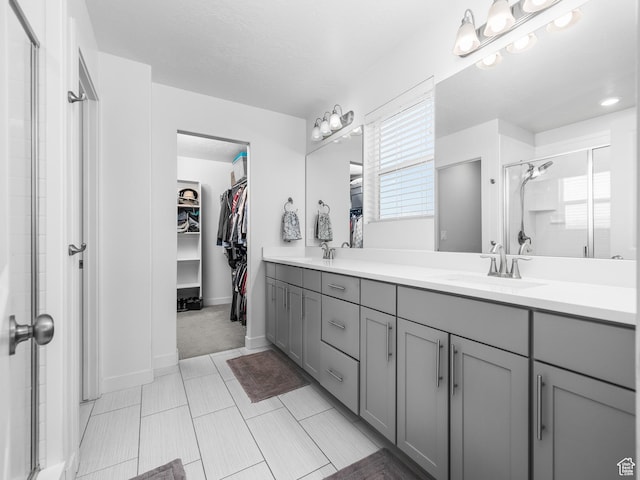 1911 N Lemongrass Dr, Saratoga Springs, UT 84045 - full bath with a shower stall, a walk in closet, and double vanity