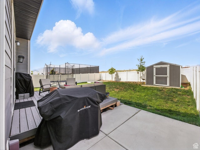 1911 N Lemongrass Dr, Saratoga Springs, UT 84045 - fenced backyard with a trampoline, a shed, a grill, and a patio
