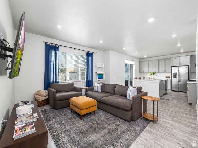 1911 N Lemongrass Dr, Saratoga Springs, UT 84045 - living room featuring healthy amount of natural light, light wood-style floors, and recessed lighting