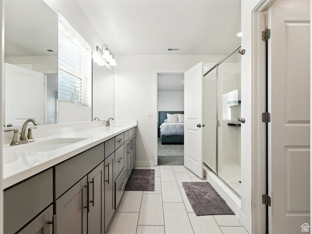 1911 N Lemongrass Dr, Saratoga Springs, UT 84045 - bathroom featuring double vanity, a shower stall, connected bathroom, and tile patterned floors