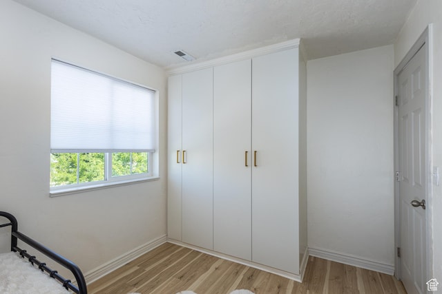1012 N Cambria Dr, North Salt Lake, UT 84054 - unfurnished bedroom with light wood-type flooring and a closet