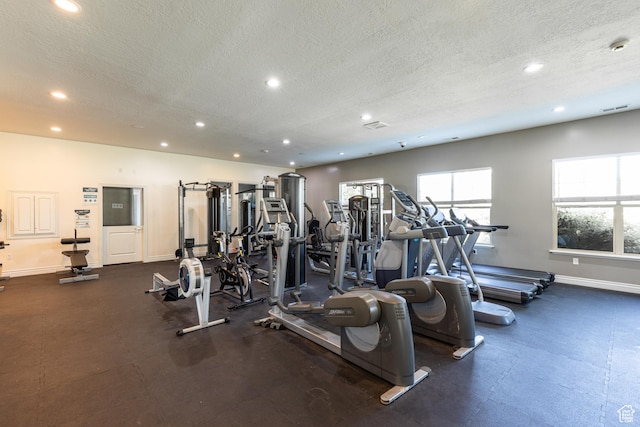 1012 N Cambria Dr, North Salt Lake, UT 84054 - exercise room featuring a textured ceiling and recessed lighting