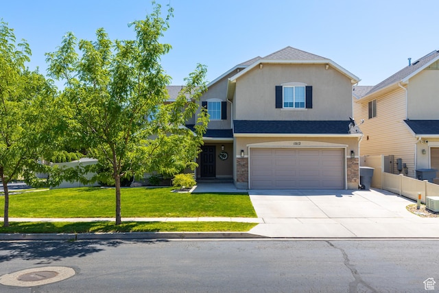 1012 N Cambria Dr, North Salt Lake, UT 84054 - view of front of house featuring concrete driveway, a garage, stucco siding, and a shingled roof