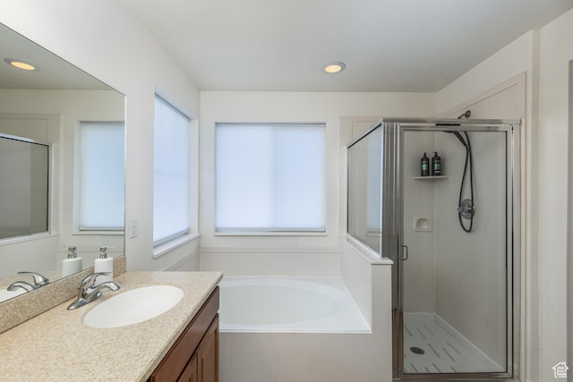1012 N Cambria Dr, North Salt Lake, UT 84054 - bathroom featuring vanity, a bath, a shower stall, and recessed lighting