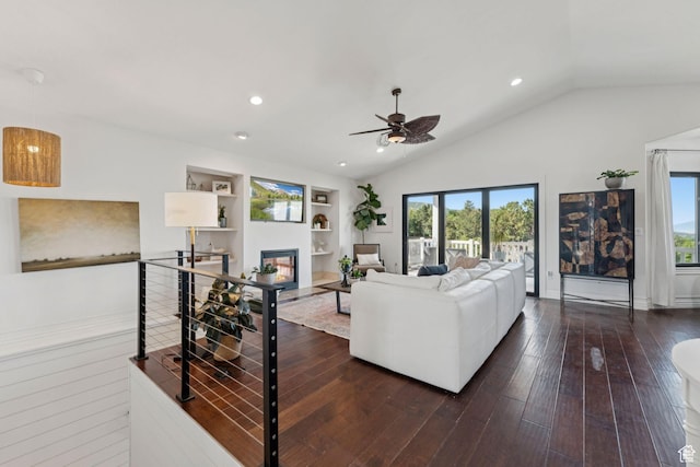 1044 S Terrace Dr E, Bountiful, UT 84010 - living room with plenty of natural light, vaulted ceiling, a ceiling fan, a glass covered fireplace, and built in features