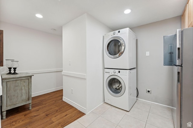 1044 S Terrace Dr E, Bountiful, UT 84010 - laundry room featuring stacked washer / dryer, electric panel, recessed lighting, and light wood-style flooring