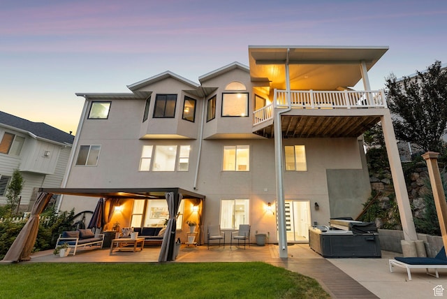 1044 S Terrace Dr E, Bountiful, UT 84010 - rear view of property with an outdoor living space, stucco siding, and a patio