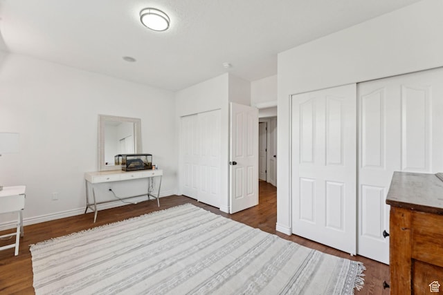 1044 S Terrace Dr E, Bountiful, UT 84010 - bedroom with multiple closets, wood finished floors, and a desk