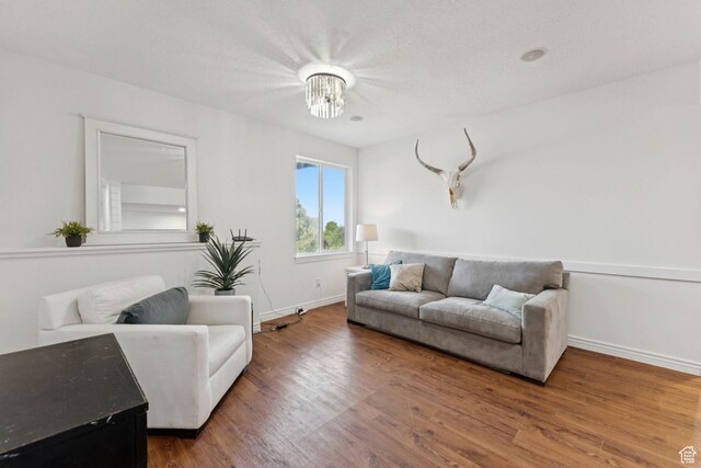 1044 S Terrace Dr E, Bountiful, UT 84010 - living area featuring wood finished floors and a chandelier