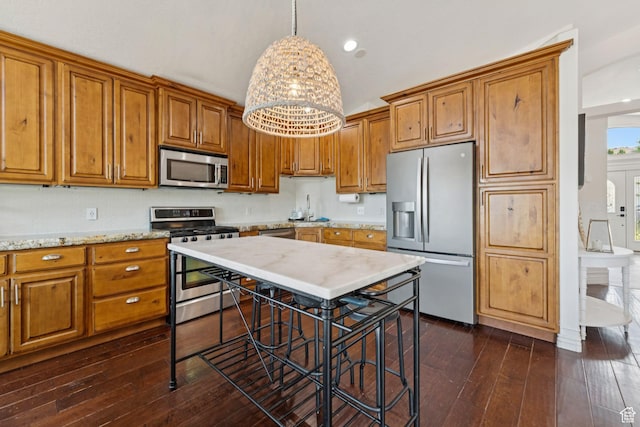 1044 S Terrace Dr E, Bountiful, UT 84010 - kitchen featuring stainless steel appliances, brown cabinets, dark wood-type flooring, pendant lighting, and recessed lighting