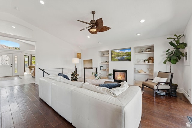 1044 S Terrace Dr E, Bountiful, UT 84010 - living room featuring a ceiling fan, a glass covered fireplace, dark wood-style flooring, recessed lighting, and built in shelves
