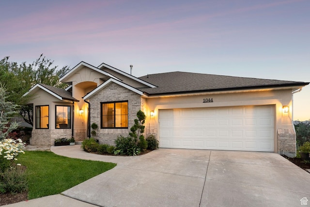1044 S Terrace Dr E, Bountiful, UT 84010 - view of front of home with driveway, a garage, and stone siding