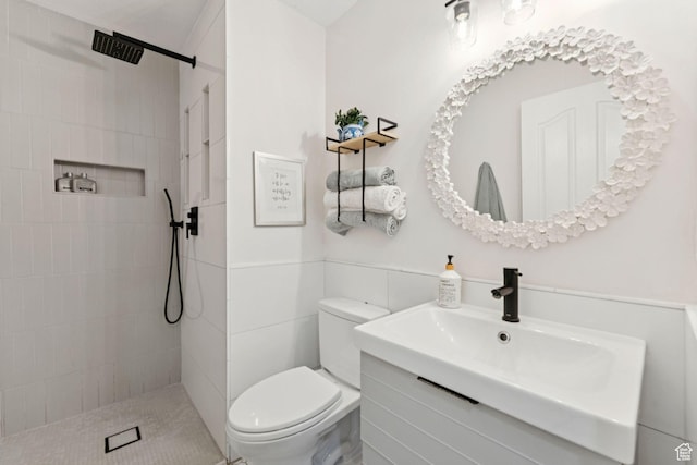 1044 S Terrace Dr E, Bountiful, UT 84010 - bathroom featuring vanity, tiled shower, and tile walls