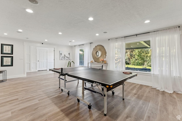 1044 S Terrace Dr E, Bountiful, UT 84010 - rec room featuring recessed lighting, light wood-style flooring, and a textured ceiling